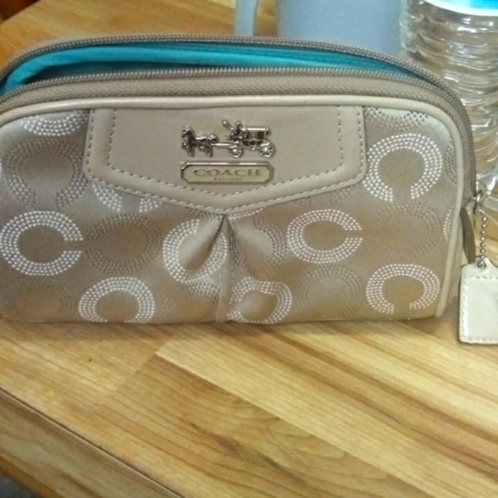 This is a coach clutch purse or makeup bag. It is almost brand new.